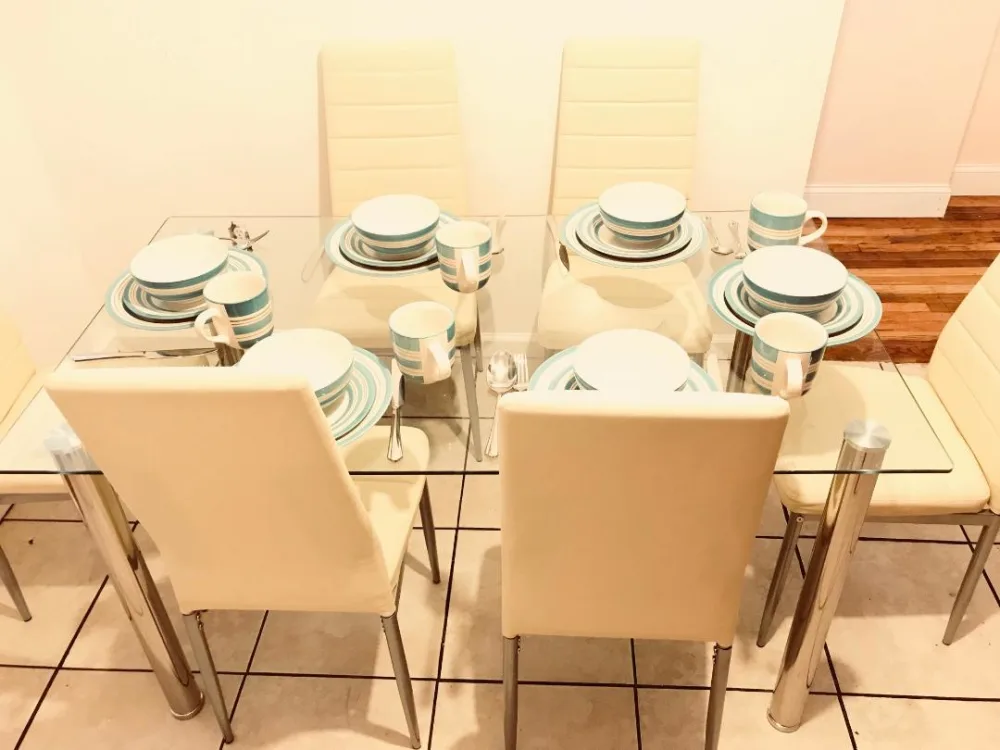 Modern dining table with settings.