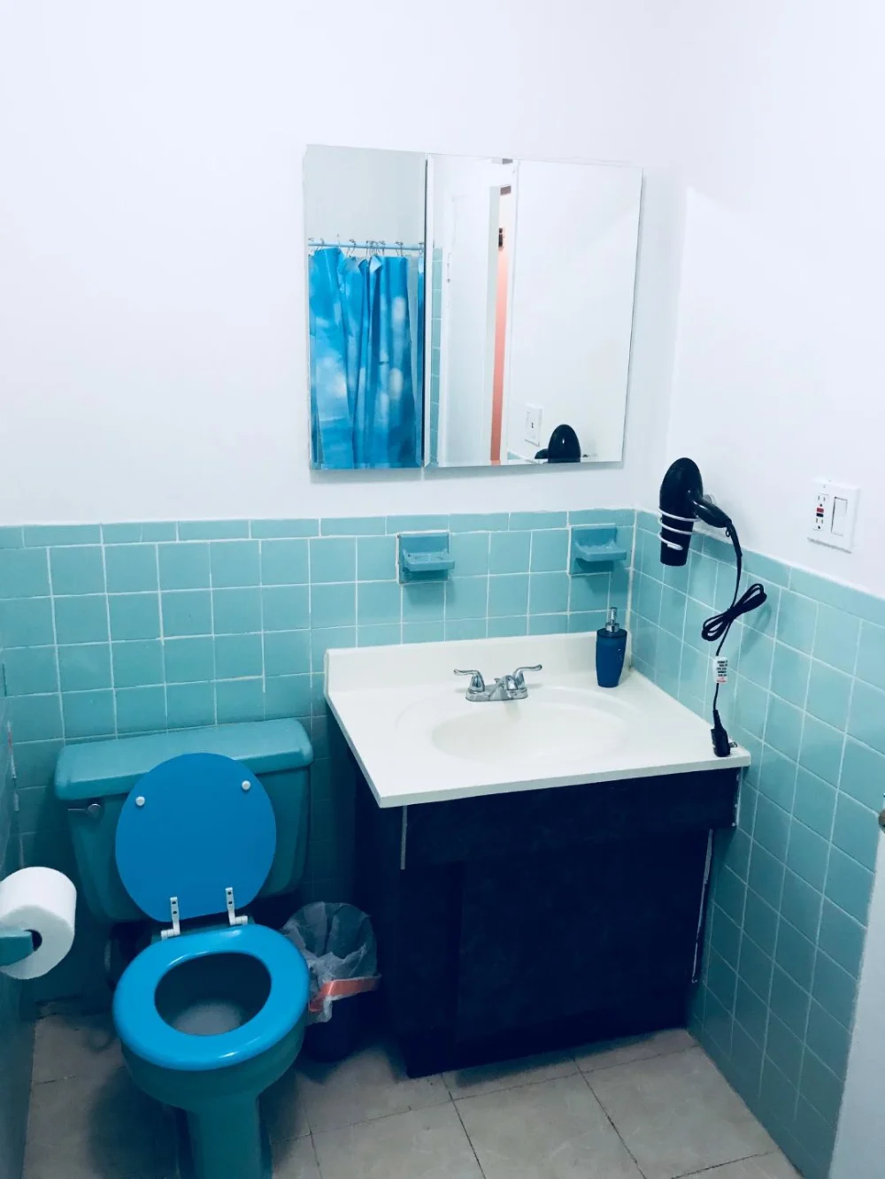 Cozy bathroom with blue accents.