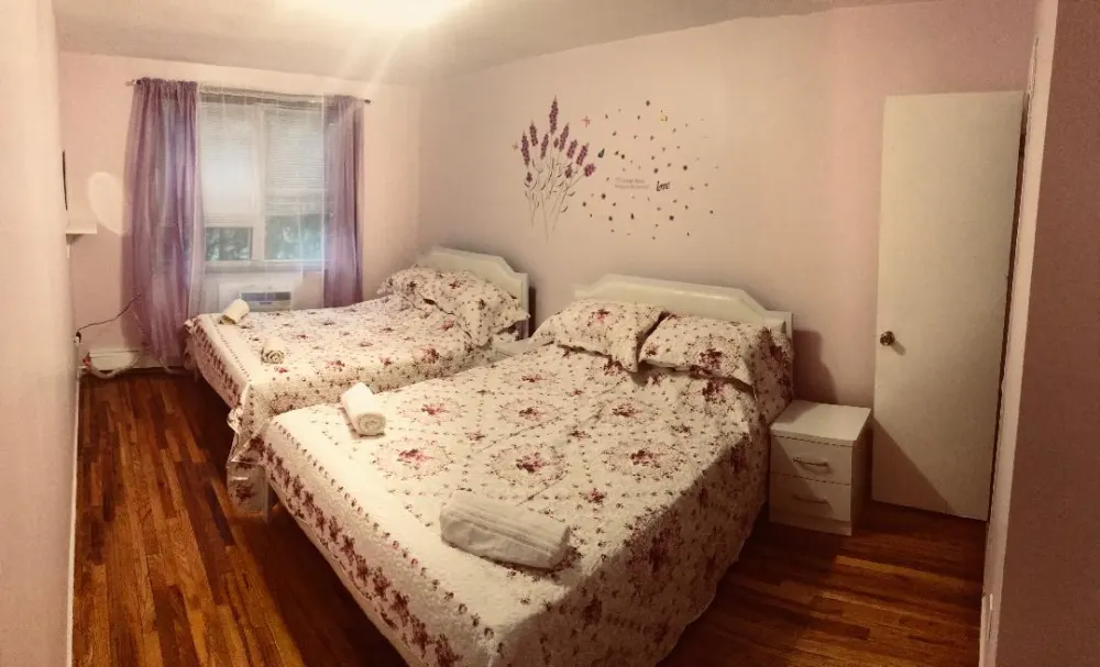 Charming bedroom with two beds.