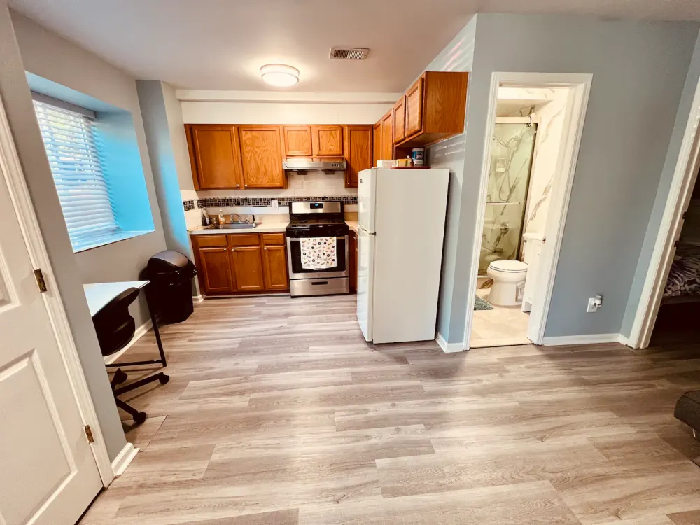 Cozy kitchen area with bathroom.