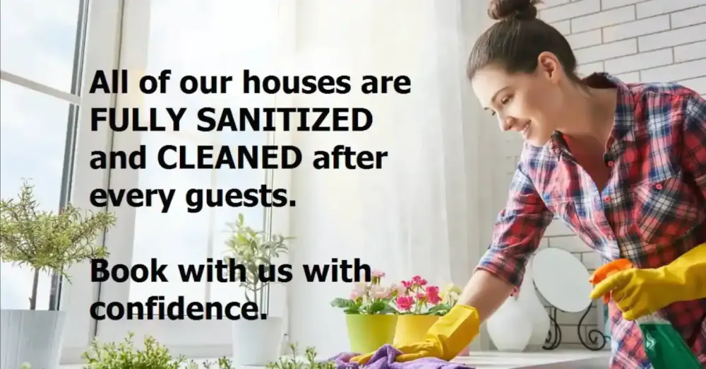Woman cleaning kitchen wearing gloves.
