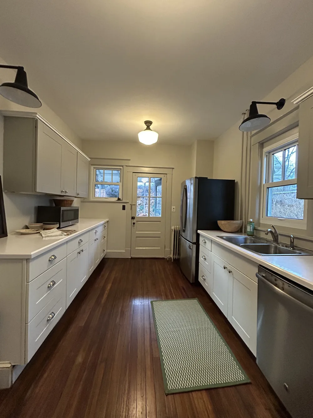 Cozy kitchen with wooden floor.