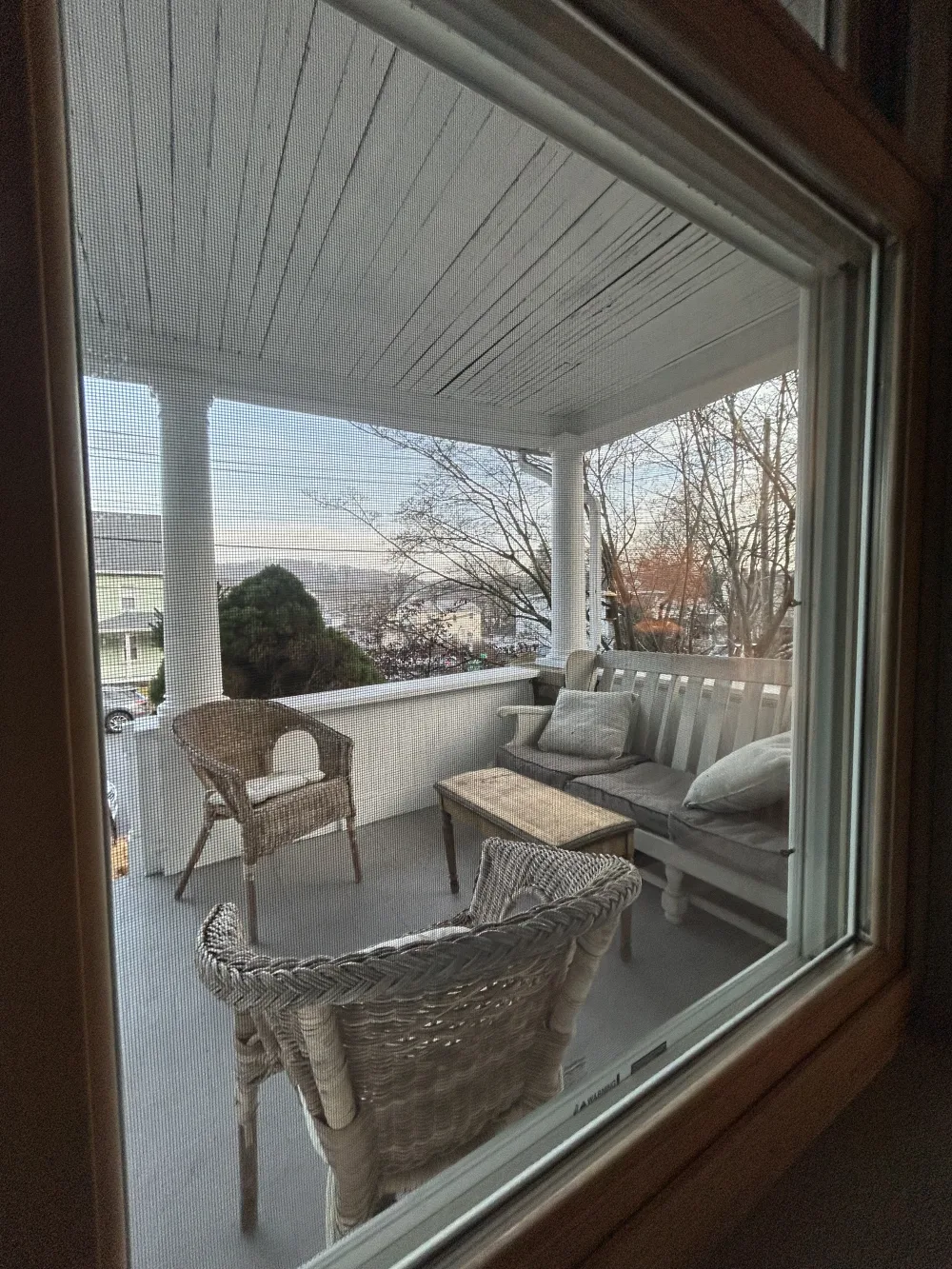 Cozy porch with wicker furniture.