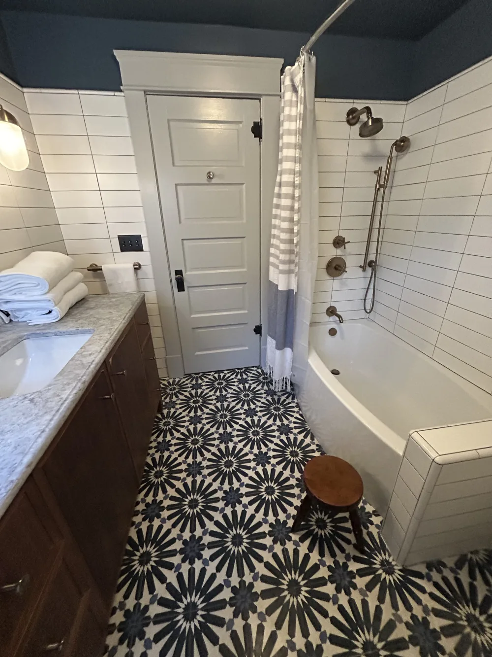 Stylish bathroom with patterned tiles.