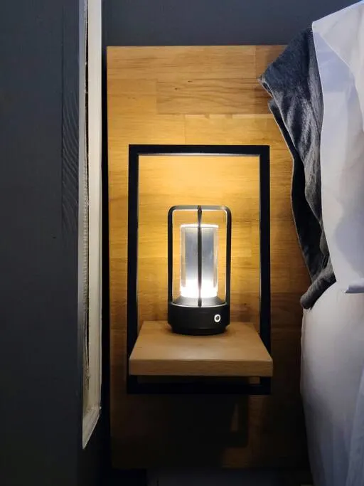 Modern bedside lamp setup. Cozy.