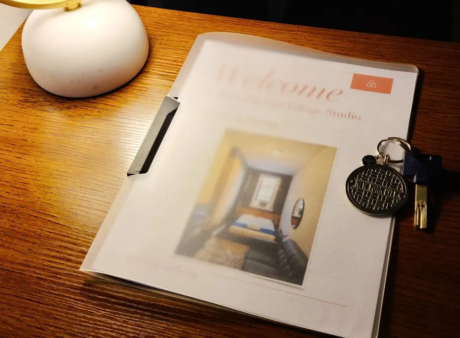 Booklet and keys on desk.