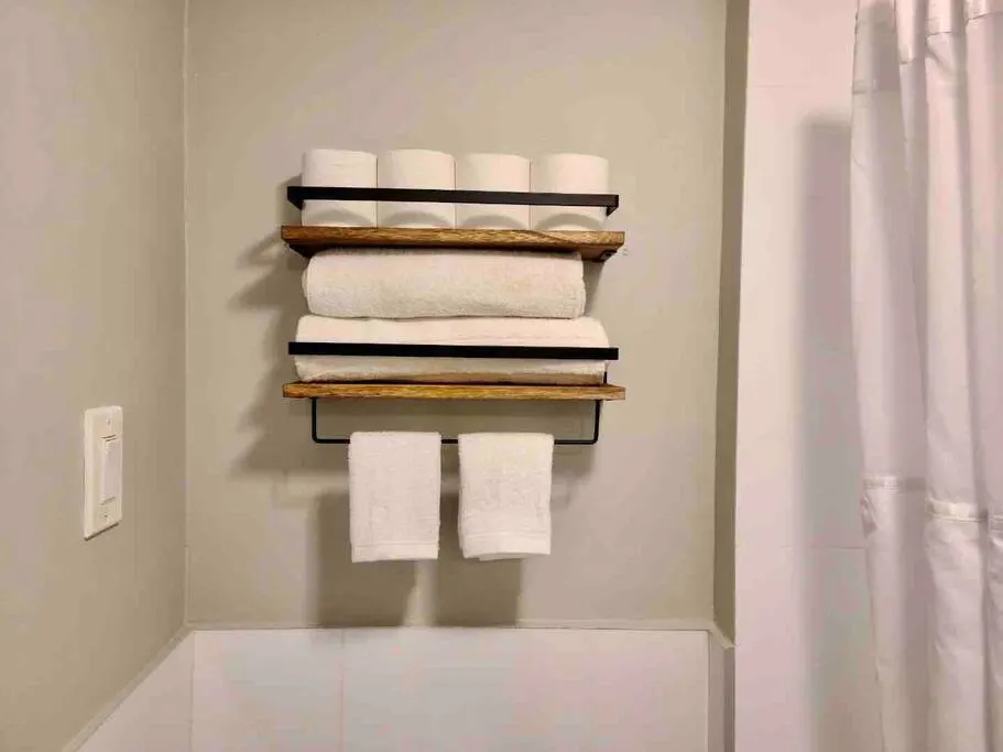 Neatly organized towels and toiletries.