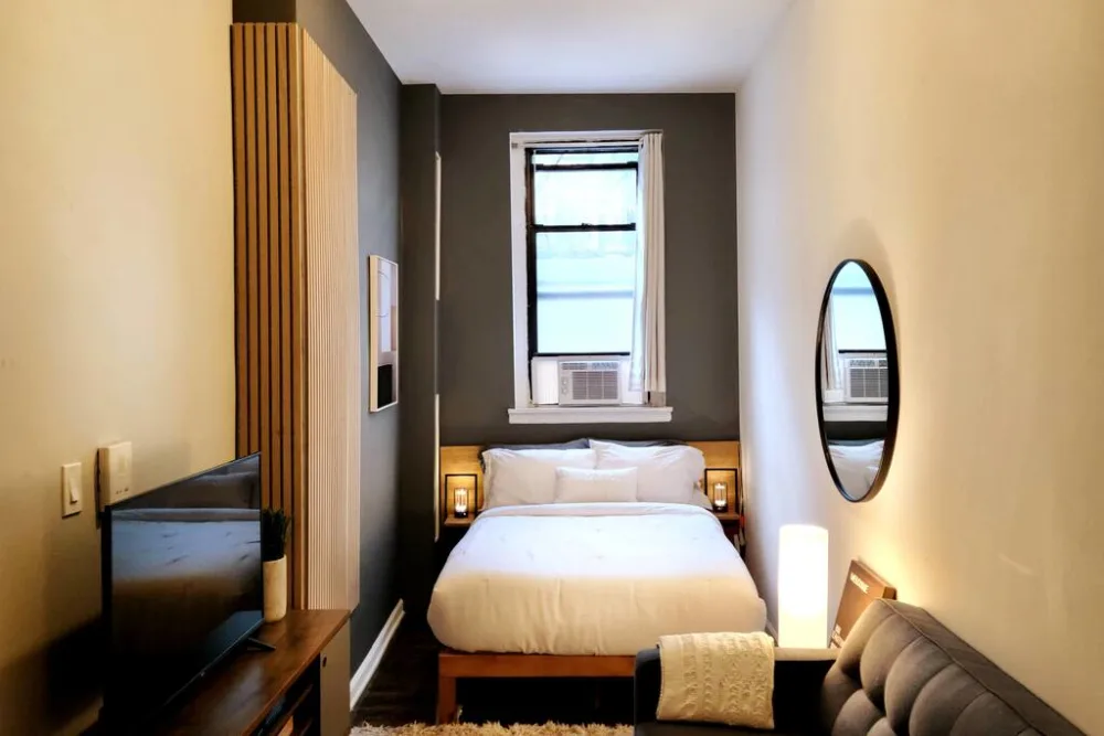 Cozy modern bedroom with window.