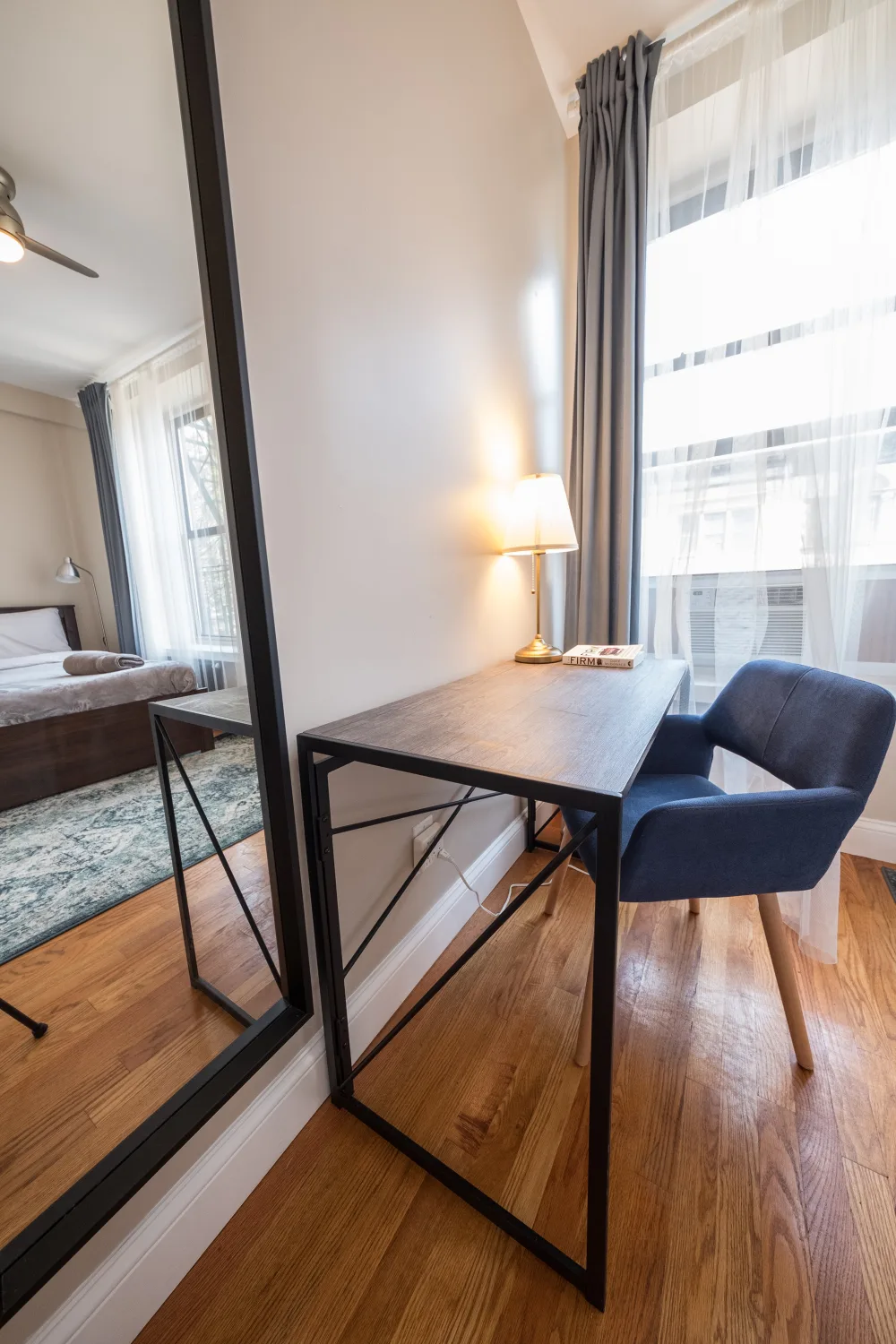 Modern bedroom with desk area.
