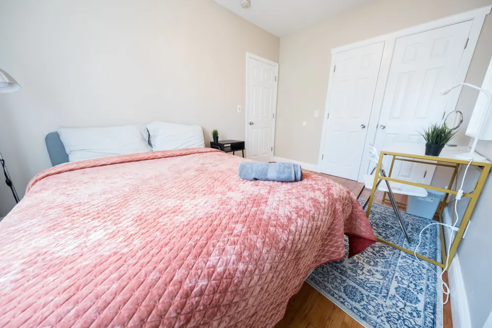 Cozy bedroom with pink bedding