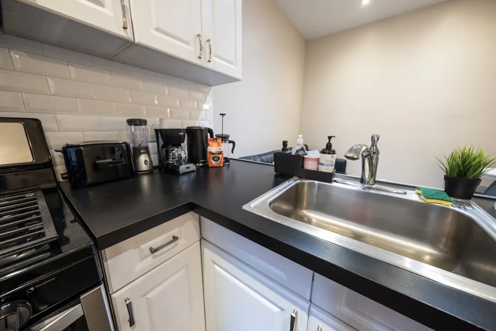 Modern kitchen with various appliances.