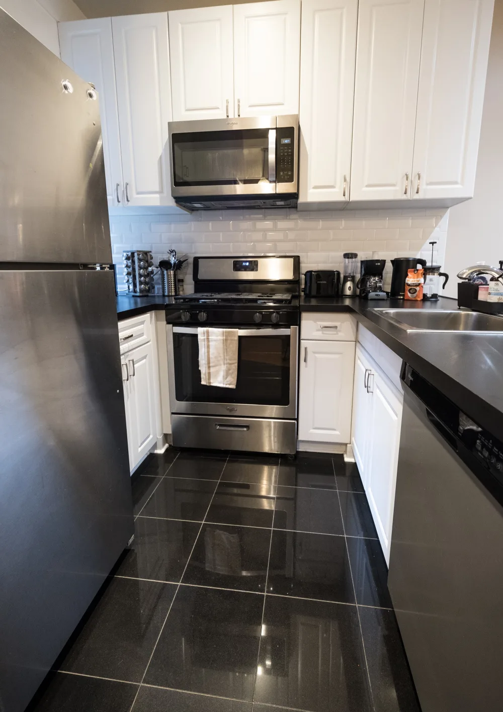 Modern kitchen with stainless steel appliances.