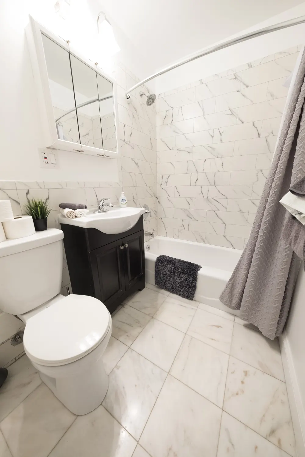 Modern bathroom with white tiles.