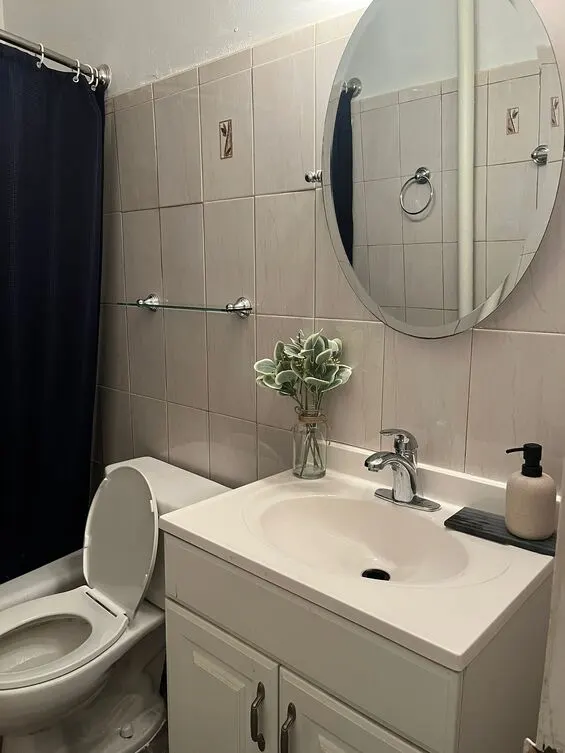 Compact bathroom with elegant decor.