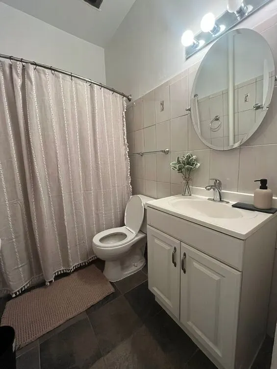 Compact bathroom with modern fixtures.