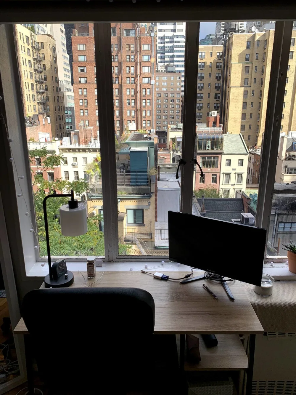 City view from apartment workspace