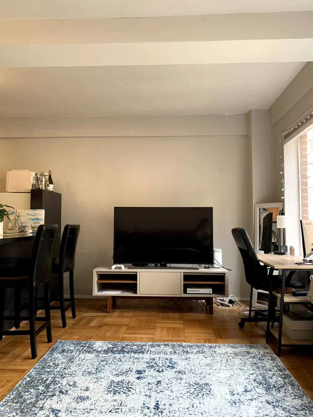 Modern living area with television.