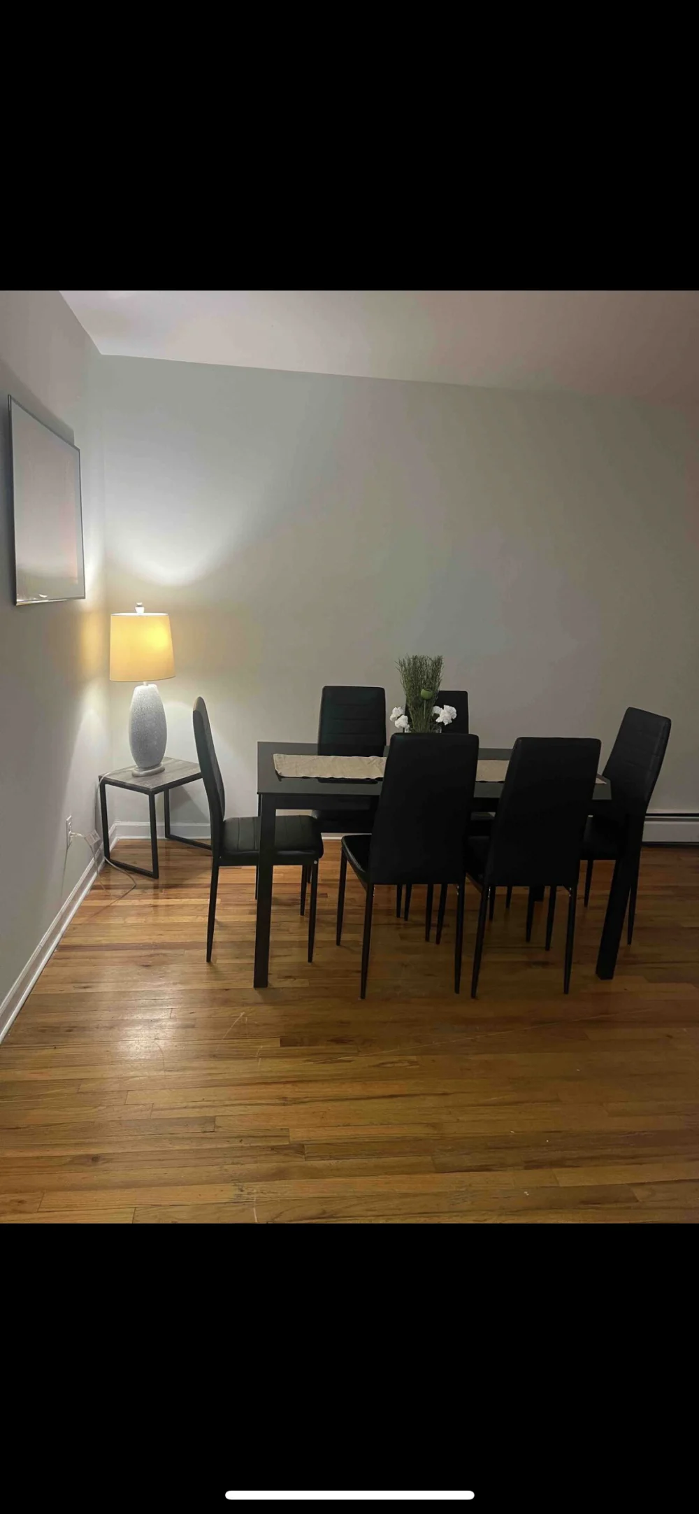 Modern dining area with lamp.