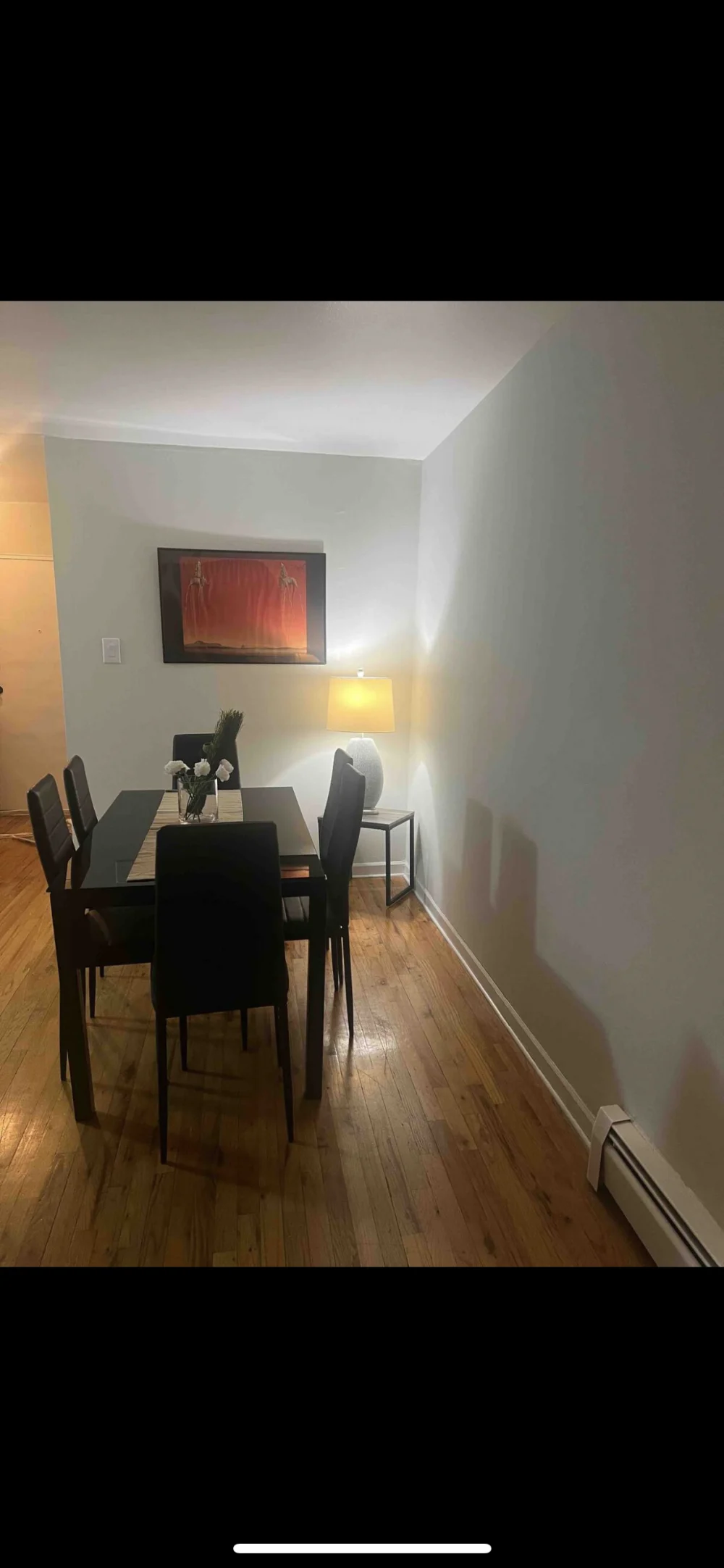 Modern dining area with art.