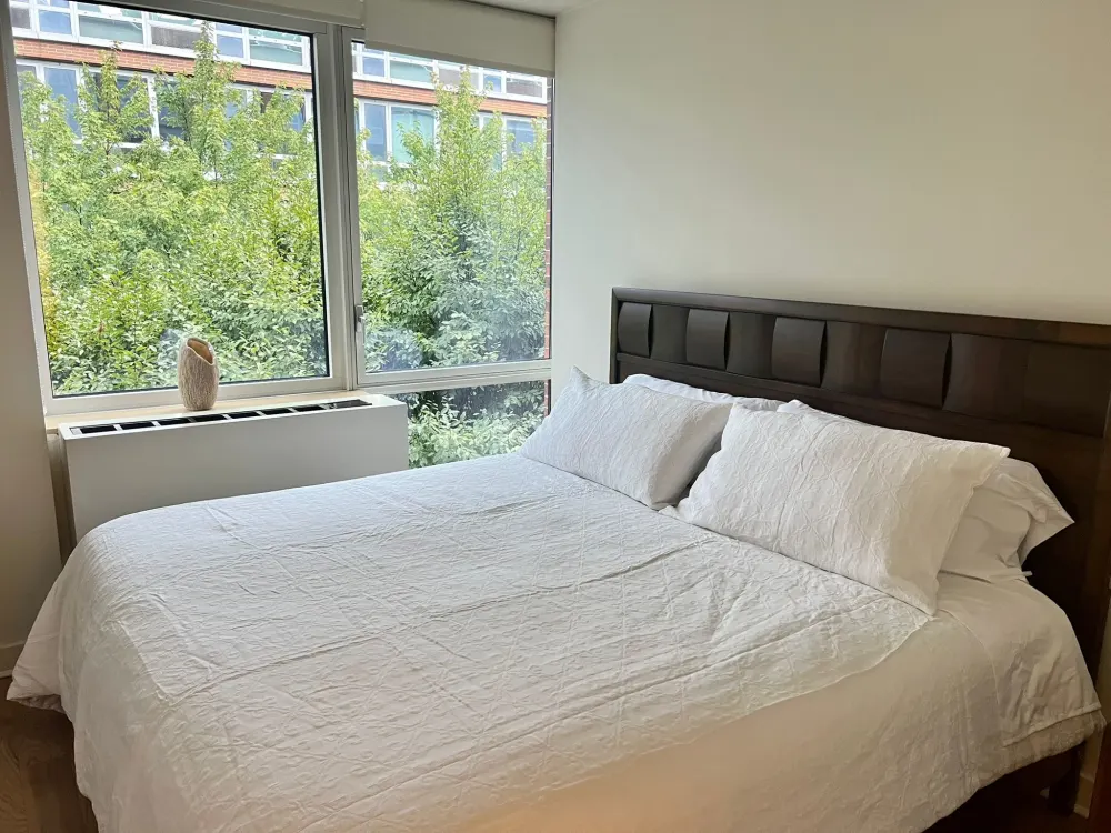 Bright bedroom with window view.