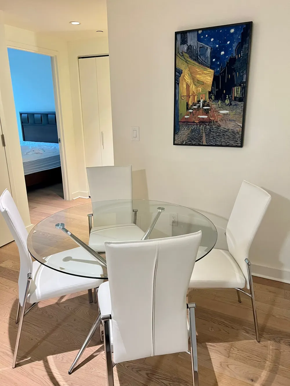 Modern dining area with artwork.