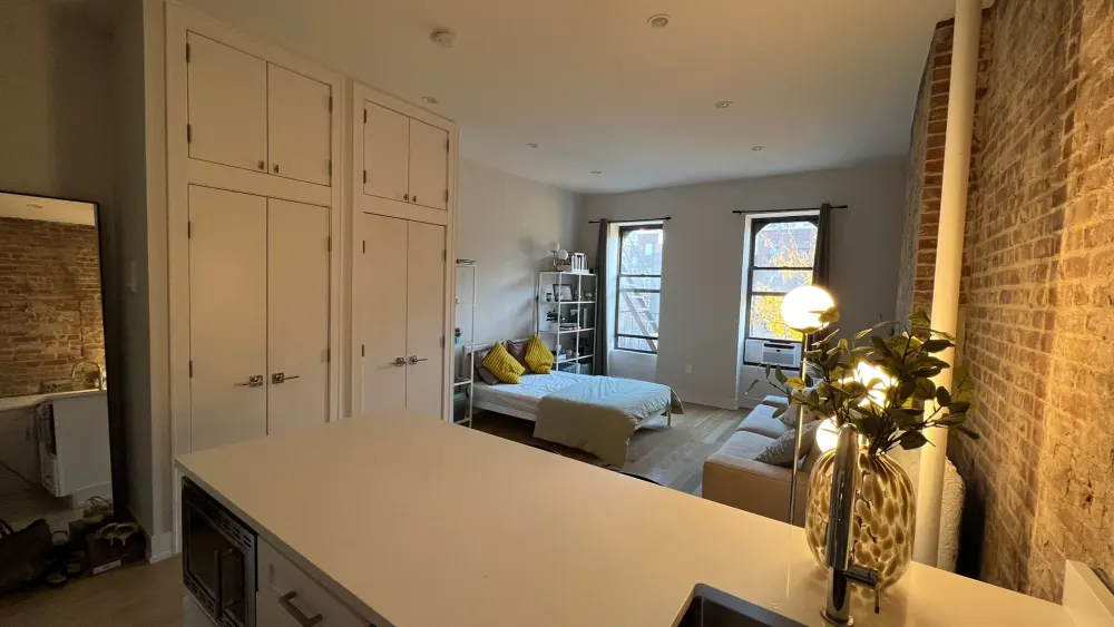 Cozy studio with exposed brick