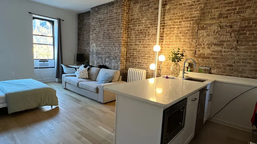 Cozy studio with exposed brick.