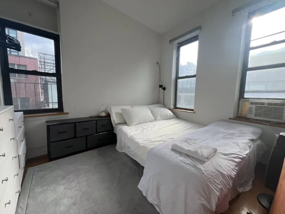 Bright bedroom with minimalist modern decor.