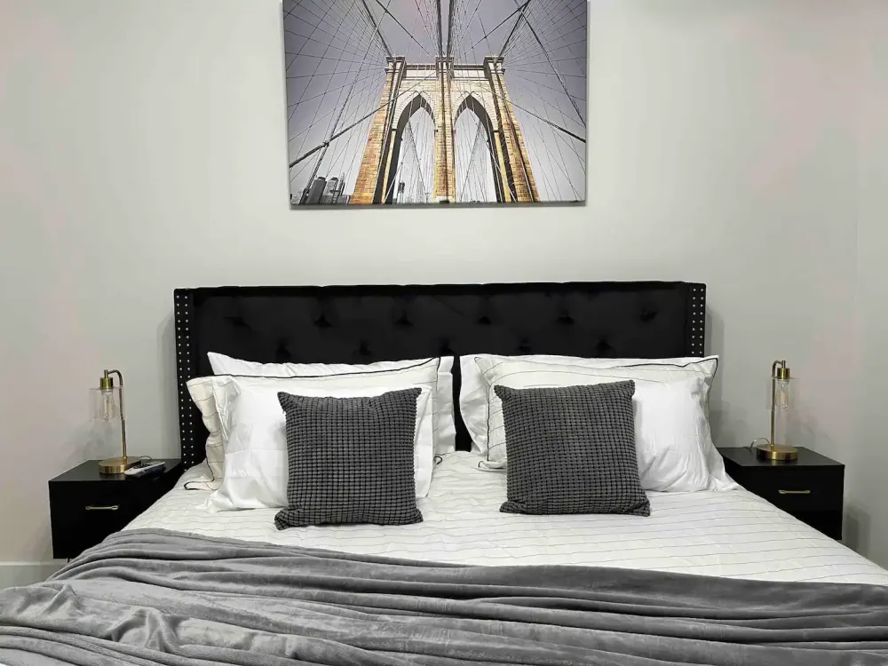 Stylish bed with Brooklyn Bridge artwork
