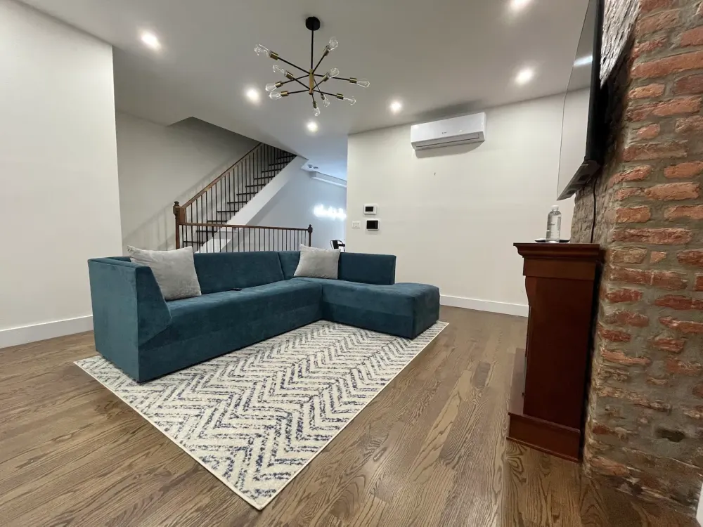 Modern living room with teal couch.