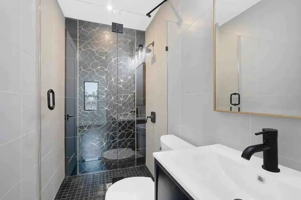 Modern bathroom with geometric shower.