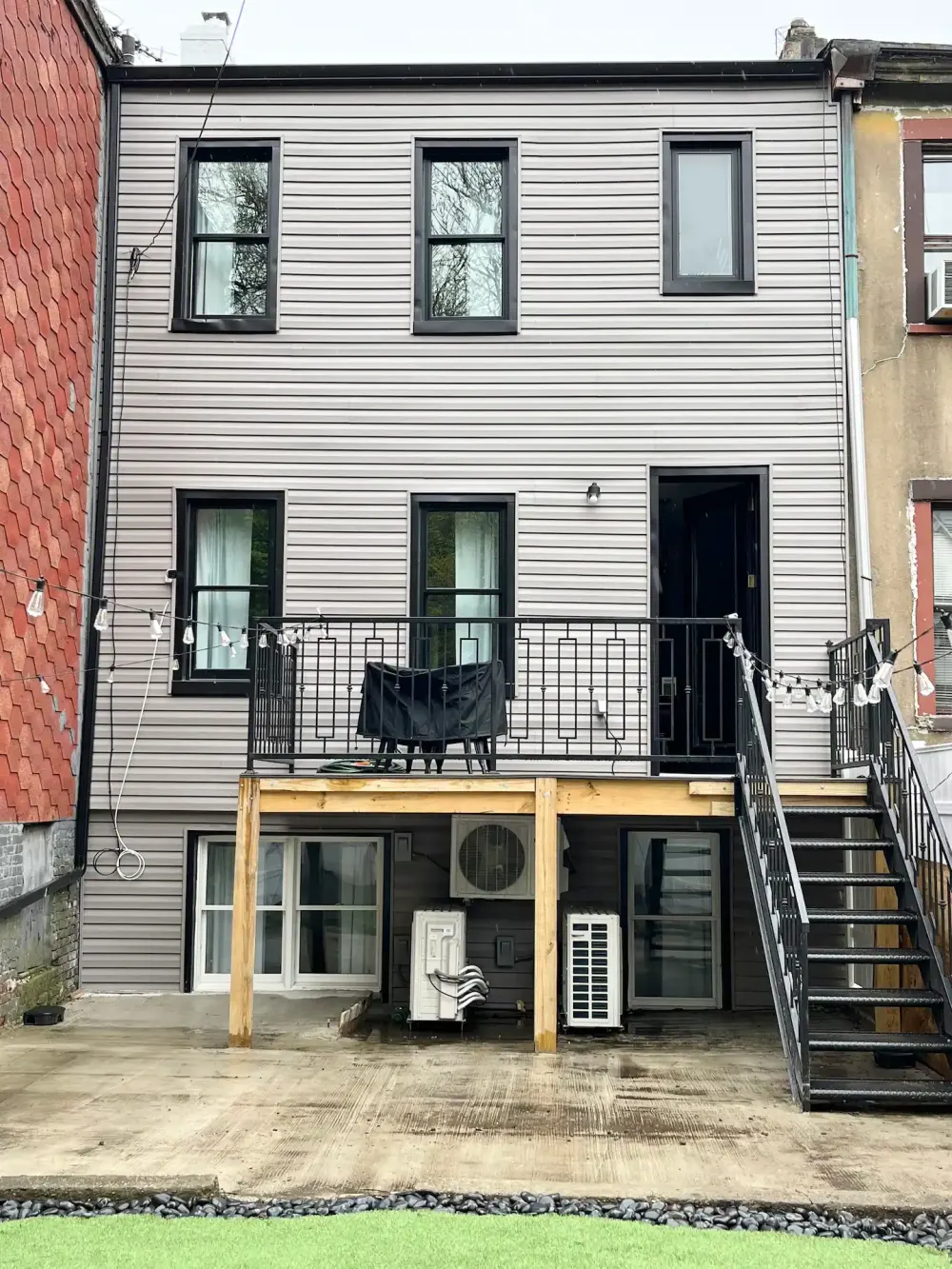 Modern townhouse with small balcony.
