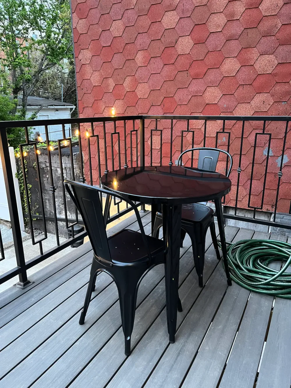 Cozy balcony with table setting.