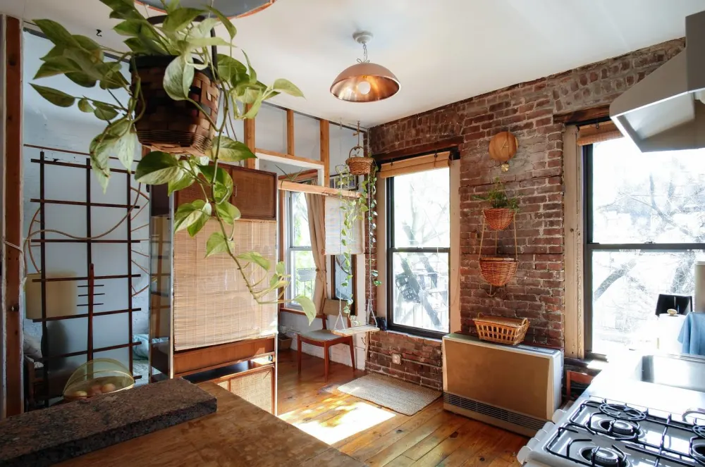 Cozy kitchen with brick walls.