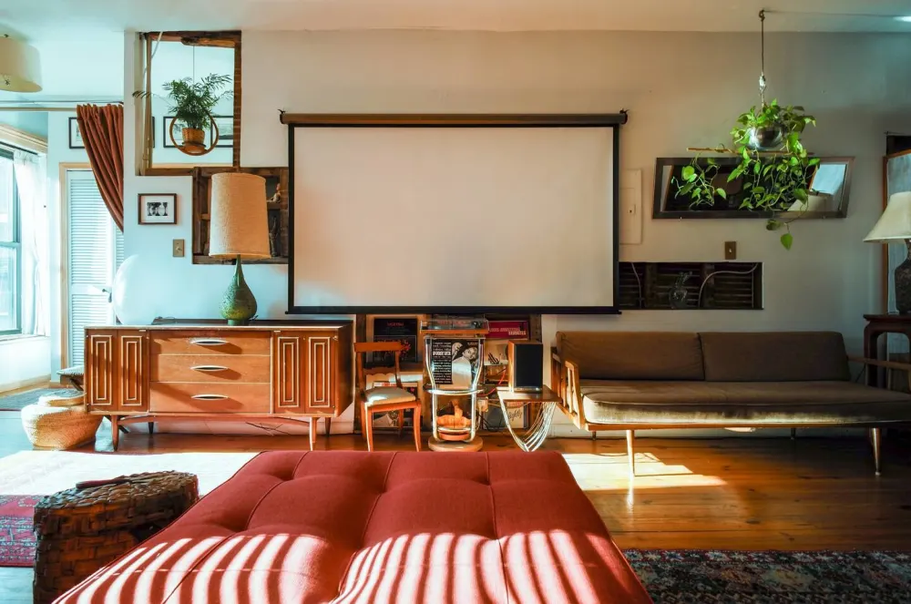 Retro living room with projector screen.