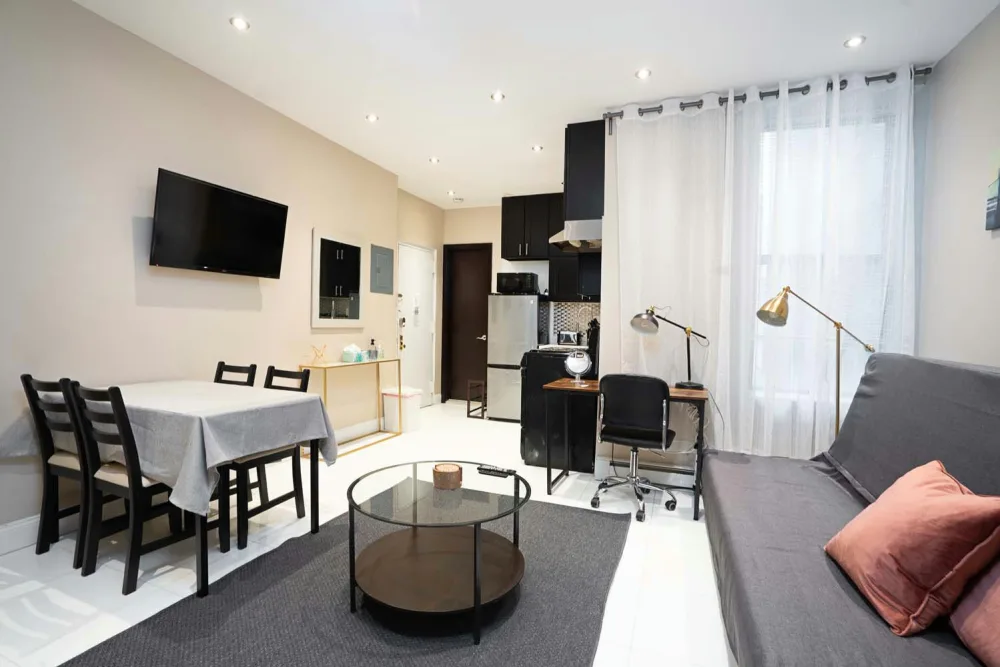 Modern studio apartment with kitchenette.