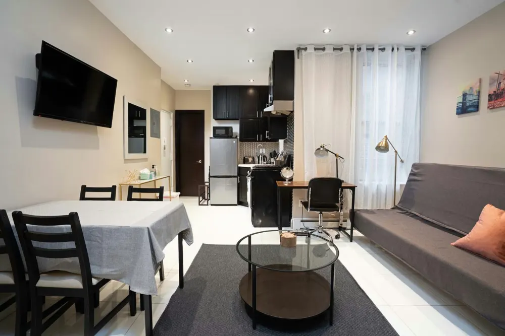 Modern studio apartment with kitchenette.