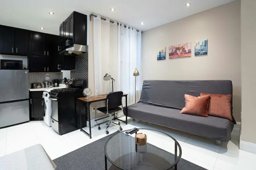 Modern, small apartment with amenities.