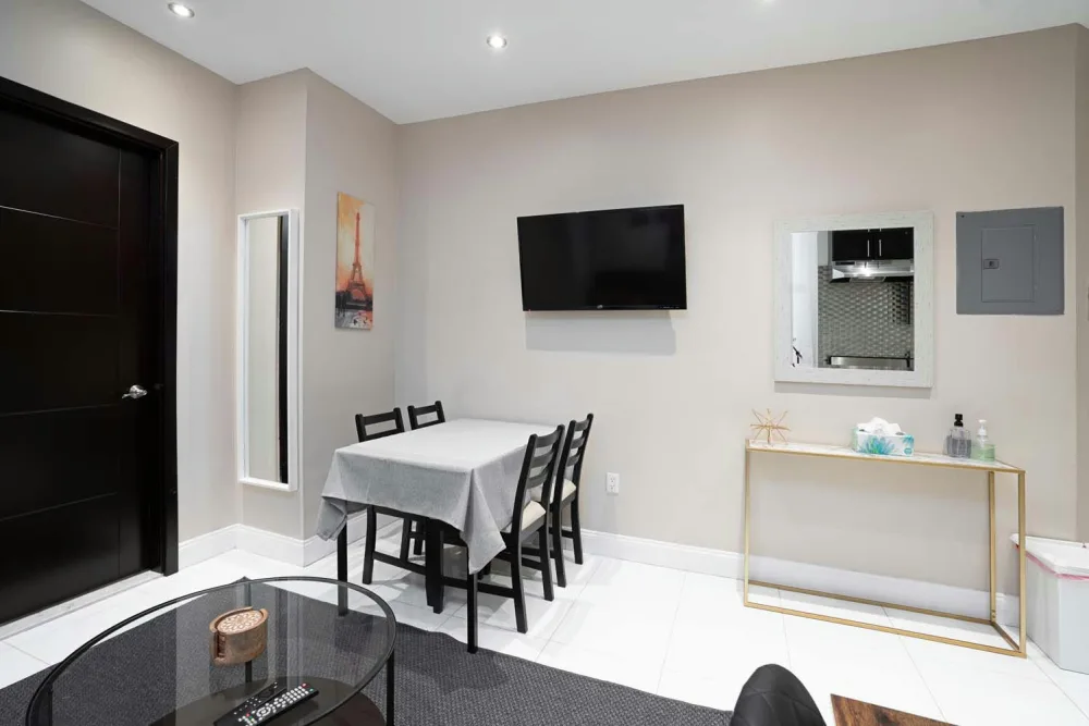 Modern dining area with TV.