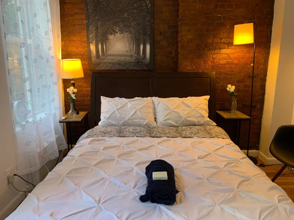 Cozy bedroom with warm lighting.