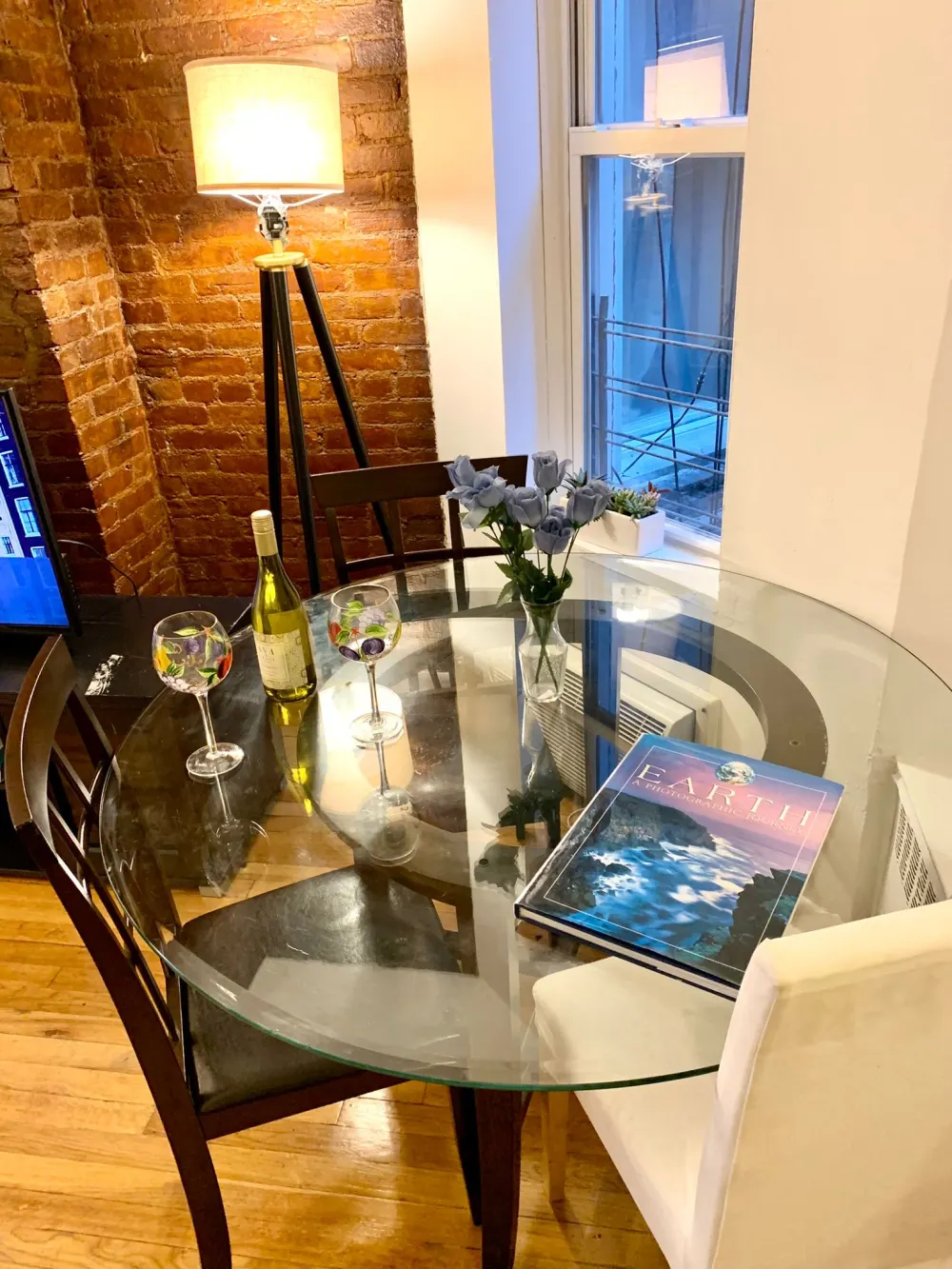 Cozy dining nook with wine.