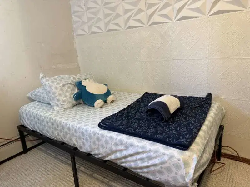 Minimal single bed with plushie