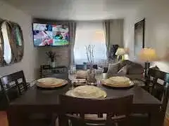 Cozy living-dining area with TV
