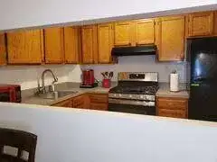 Cozy kitchen with wooden cabinets