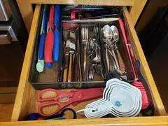 Organized kitchen drawer with utensils