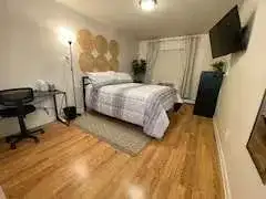 Cozy bedroom with desk, TV