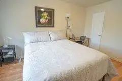 Cozy minimalist bedroom with artwork