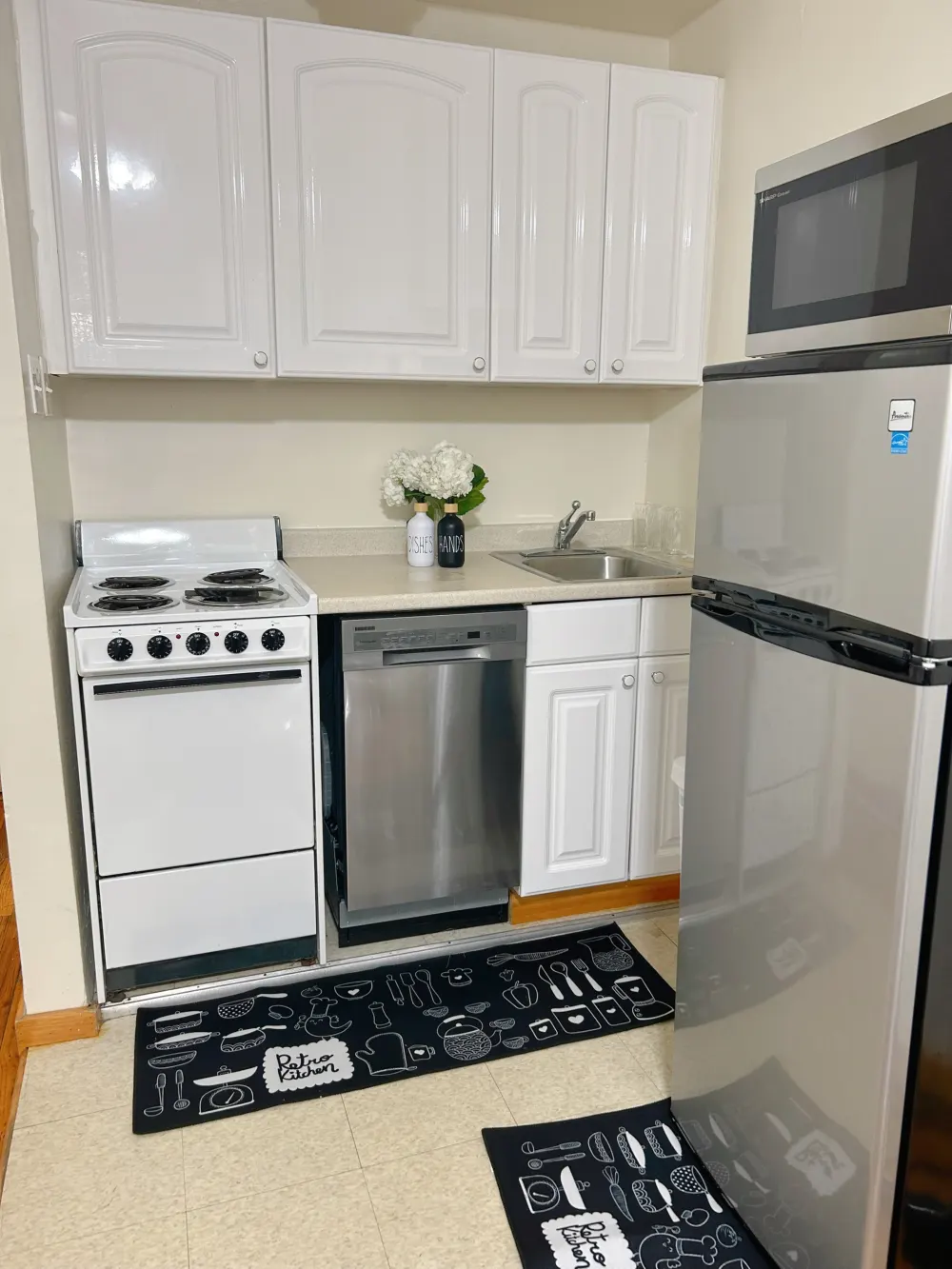 Compact kitchen with modern appliances.