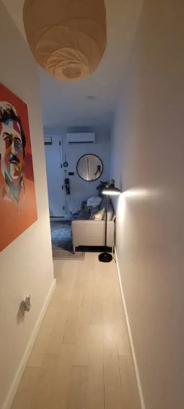 Hallway leading to cozy living