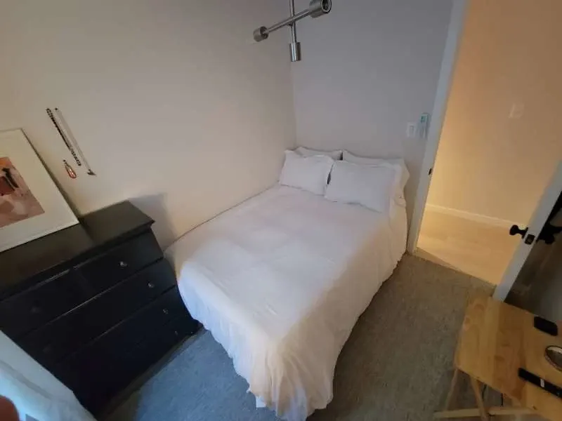 Cozy small bedroom with bed